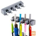 Stenski nosilec ročajev za 4 pripomočke